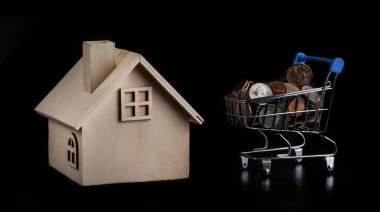 Bir süpermarketten tramvay almak. İçinde Amerikan paraları ve siyah arka planda sembolik ahşap bir baraj var.