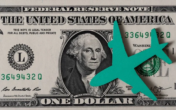 Die Symbolfigur Eines Flugzeugs Auf Einem Dollar Schein — Stockfoto