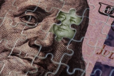Bir bulmaca ve Başkan Mao 'nun portresinden oluşan 100 dolarlık banknotun bir parçası 1 Çin yuanı değerinde bir banknottan.