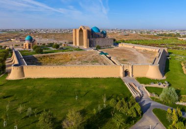 View from a quadcopter of the medieval mausoleum of Khoja Akhmet Yassaui in the Kazakh city of Turkestan - the heart of the Turkic world clipart