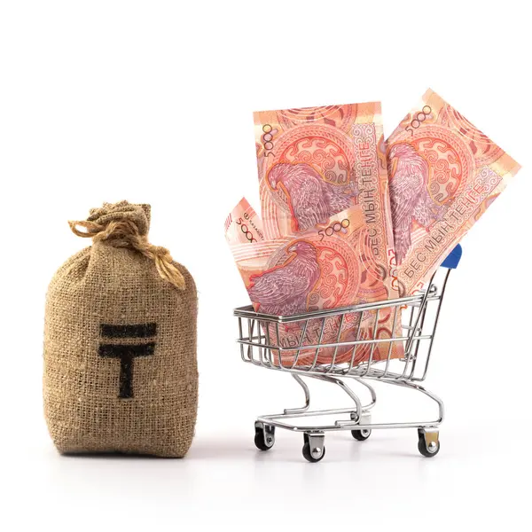 stock image New 5000 KZT banknotes in a miniature shopping trolley from a supermarket