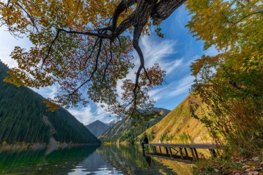 Almaty region, Kazakhstan, 10.08.2019. Picturesque autumn view of Lake Kolsai in the Almaty region of Kazakhstan clipart