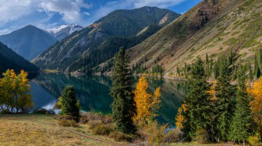 Picturesque autumn view of Lake Kolsai in the Almaty region of Kazakhstan clipart