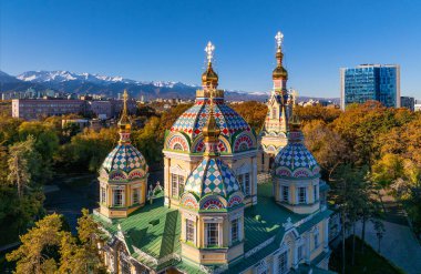 View from a quadcopter of the wooden Ascension Cathedral, built in 1907, on a sunny autumn morning in the Kazakh city of Almaty clipart