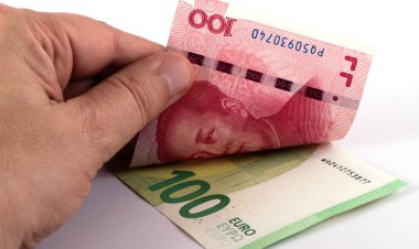 Banknotes in denominations of 100 Chinese yuan and 100 euros clipart