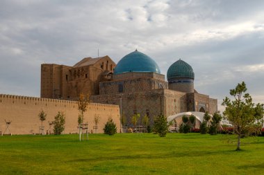 The medieval mausoleum of Khoja Akhmet Yassaui in the Kazakh city of Turkestan - the heart of the Turkic world clipart