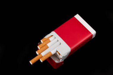 Open red pack of cigarettes on black background clipart