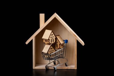 Siyah arka planda sembolik ahşap evler