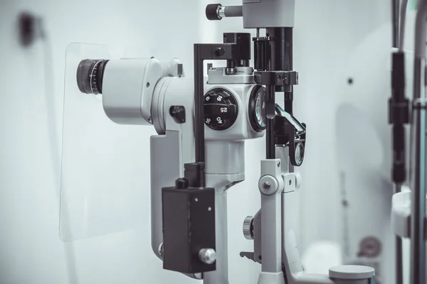 stock image Different devices for measuring diopter and eye examination. Visit at the ophtalmologist, eye doctor, with all devices and appliances. Laser surgery.