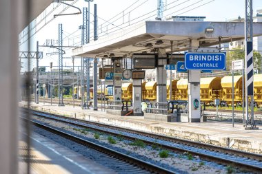 Public access platforms at brindisi train station. Main or central train station of brindisi in spring afternoon. clipart