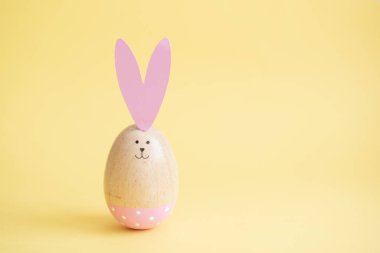 Colorful easter eggs yellow background. Easter holiday concept