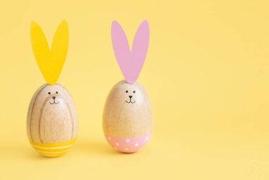 Colorful easter eggs yellow background