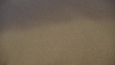 4k Small wave, Soft wave on sand beach for opening video, text space. white sand beach, Ocean Wave On Sandy Beach