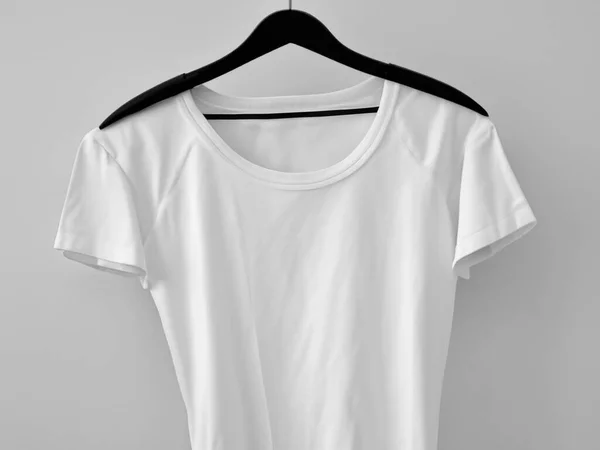 Realistic t-shirt mockup | Blank black and white t-shirt on hanger, design mockup. Clear plain cotton t-shirt mock up template. Apparel store logo mock branding display