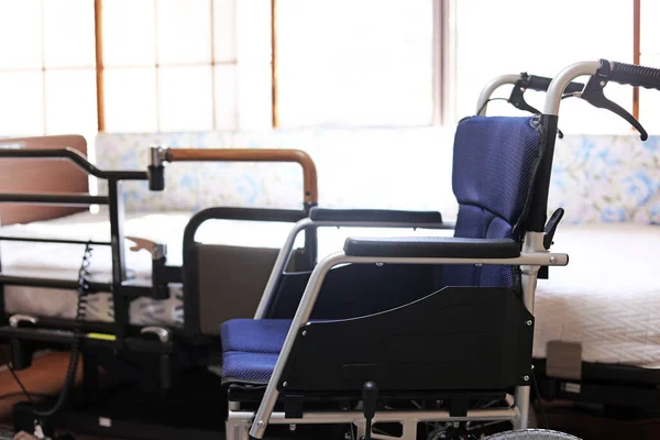 Folding small wheelchair and electric bed for nursing care