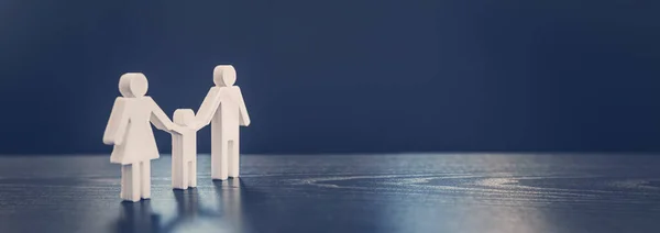 stock image Figurine of the family on the black background. Abstract background.