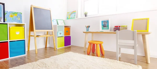 Comfortable room with colourful furniture in sunny day. Concept of the child room and kindergarten.