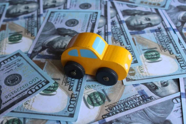 Selective focus image of car and money. Transportation and automobile industry concept