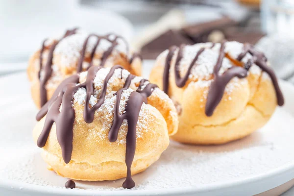 Closeup Homemade Profiteroles Whipped Cream Chocolate Filling Covered Melted Chocolate — Stock Photo, Image