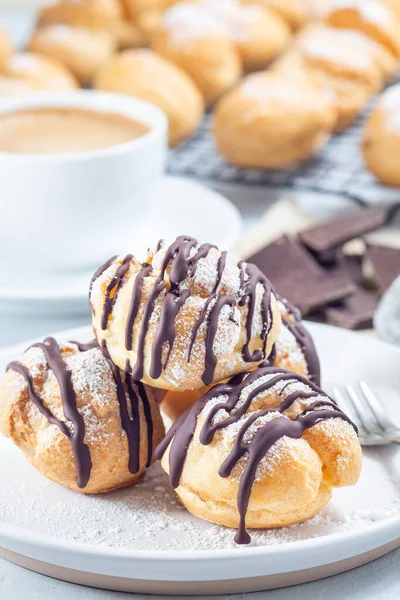 Profiteroles Whipped Cream Chocolate Filling Covered Melted Chocolate Plate Vertical — Stock Photo, Image
