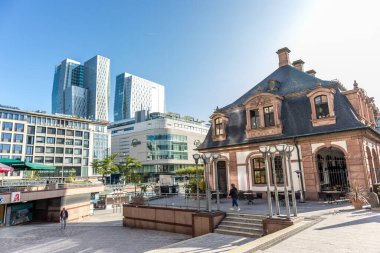 Frankfurt, Germany - 30th September 2022: Photographer visiting Frankfurt, exploring the so called Hauptwache and its surroundings at a cold but sunny day in Autumn.