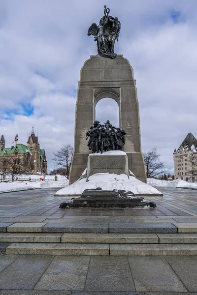 Visiting the national war memorial of Canada in downtown Ottawa at a cold but sunny day in winter.