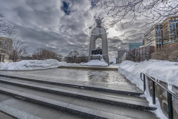 Visiting the national war memorial of Canada in downtown Ottawa at a cold but sunny day in winter.