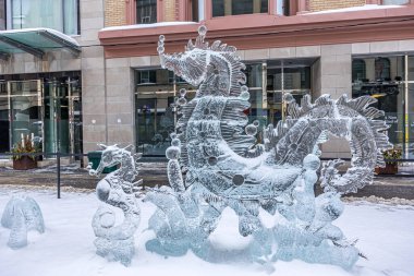 Ottawa, Canada - February 08th 2023: A german photographer discovering the pedestrian zone in downtown Ottawa, viewing ice sculptures of the so called winter lude.