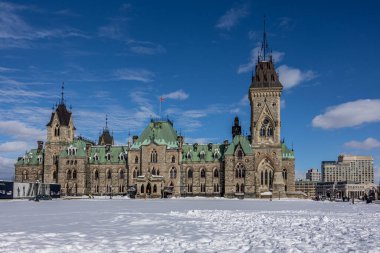 Ottawa, Canada - February 08th 2023: A german photographer discovering Majors Hill Park in downtown Ottawa with view to the historical buildings.