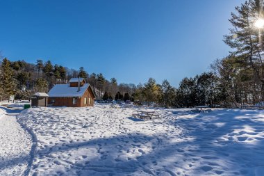 Winter wonder land not far away from Ottawa with a hut, Ontario in Canada at a cold but sunny day in winter.