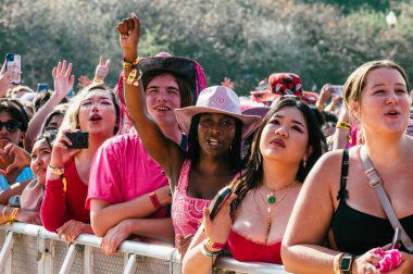 Chicago, Illinois, United States - August 1st, 2024: Fans of Chappell Roan enjoy her performance on the first day of Lollapalooza in Grant Park, Chicago. clipart