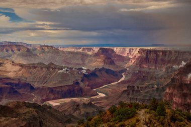 A Summer thunderstorm dropping heavy rain over the Grand Canyon, as seen from the south rim near the Desert View Watchtower In Arizona, USA.