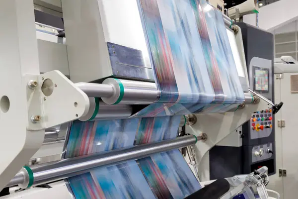 stock image new innovative technology of automatic label printing machine with digital control panel. printing on continuous plastic film for wrapping on food product packaging in the printing factory.