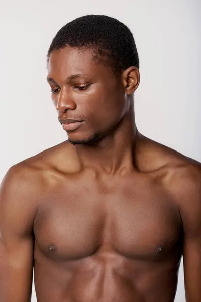 stock image Shirtless African American man in a studio setting with white background