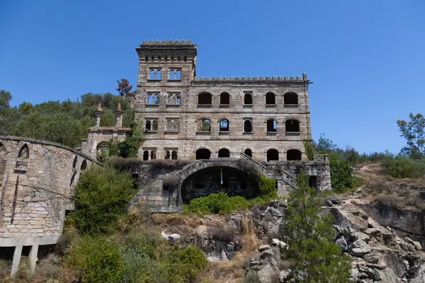 Stock image Abandoned Termas Rdium (Hotel Serra da Pena) ruins in Sortelha, Portugal. This historic stone structure, nestled in a rugged landscape, symbolizes architectural decay and forgotten heritage