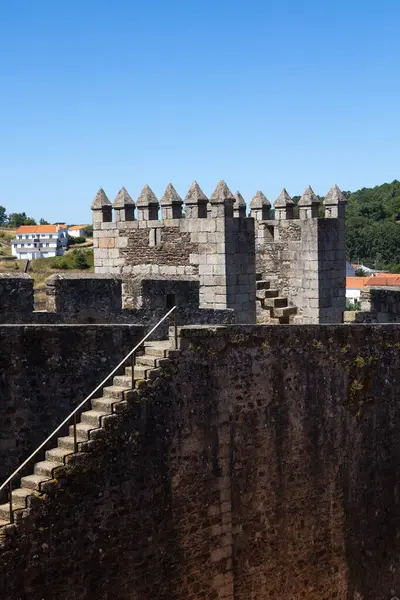 stock image Sabugal Castle in Portugal features imposing stone walls and a historic stone staircase, showcasing its medieval architecture. The image captures the fortress under a clear blue sky