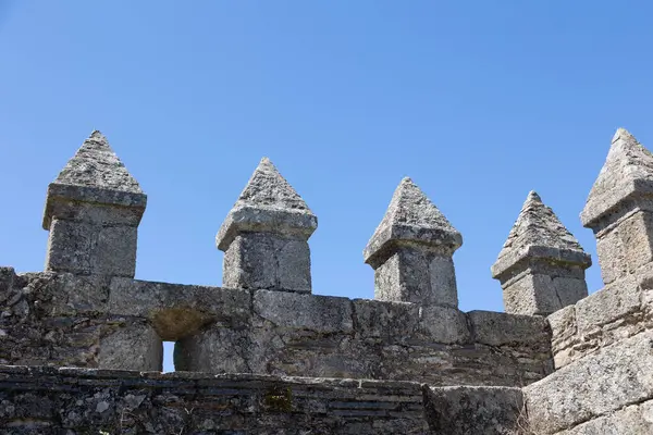 stock image Sabugal Castle in Portugal features imposing stone walls and a historic stone staircase, showcasing its medieval architecture. The image captures the fortress under a clear blue sky