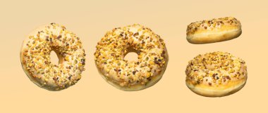 Şam fıstıklı donutlar yumuşak sarı bir zemin üzerinde sanatsal olarak düzenlenir, minimalizm ve canlı dokuyu parlak, yüksek anahtarlı yemek fotoğrafçılığı kompozisyonu ile birleştirir..