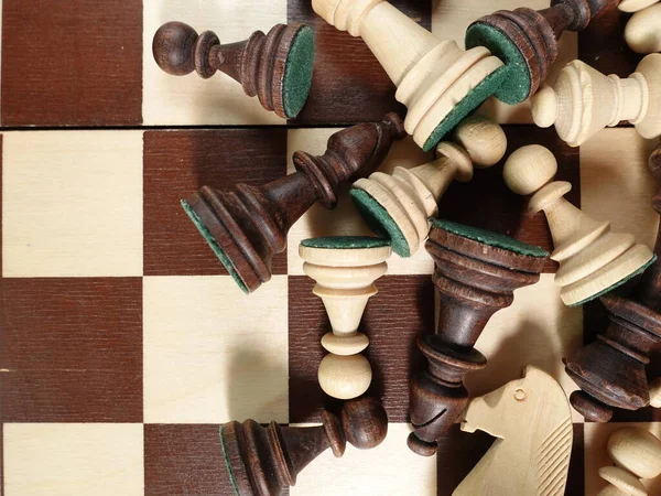 Chess pieces are scattered on the chessboard. Banner for advertising a chess school and preschool