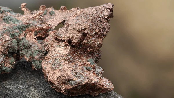 raw copper ore resting on a rock