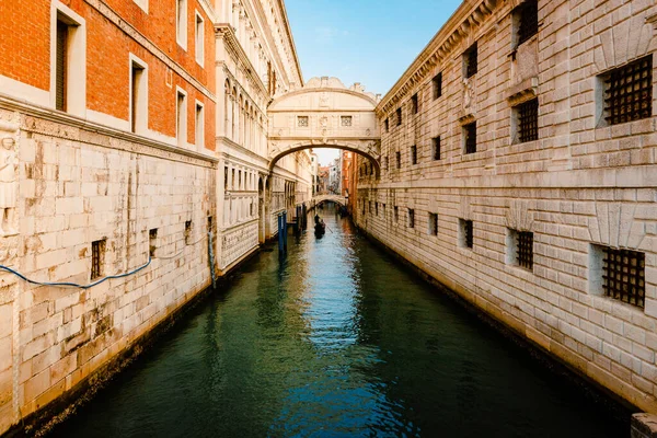 stock image Venice, Italy - October 2022: The famous Bridge of Sighs, in Baroque style and built of Istrian stone, with gondola crossing the canal