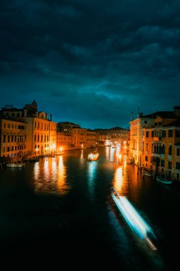 Venice, Italy - November 2022: Grand Canal of Venice at night with boat trails, long exposure
