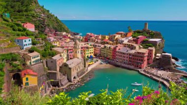 Seaside perspective of Vernazza with its pastel buildings and Mediterranean backdrop