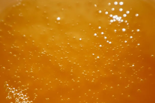 stock image Honey, freshly poured, with air bubbles, suitable for texture or background. The texture of the honey. Healthy food concept. Selective focus.