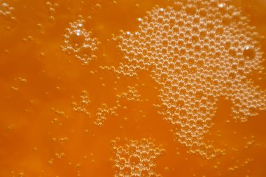 Tatlım, yeni doldurulmuş, hava kabarcıklı, doku veya arka plan için uygun. Bal dokusu. Sağlıklı gıda konsepti. Seçici odak.