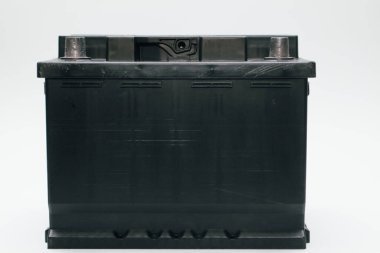 Black lead acid battery for car. Auto concept, isolated on white. Concept of service, maintenance, charging car battery
