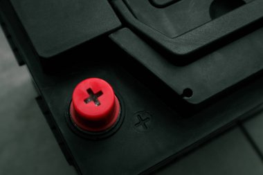 Plus of the old battery. Charging car battery with electric current.
