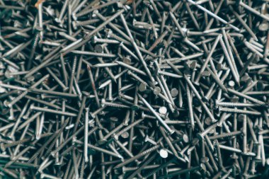 Demir çivilerin arka planı. Arkaplan dokusunu çiviler