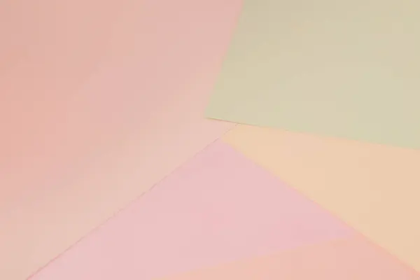 Abstract geometric colored paper background. Delicate pastel colors. Abstract pattern with soft colors. Colored paper background.
