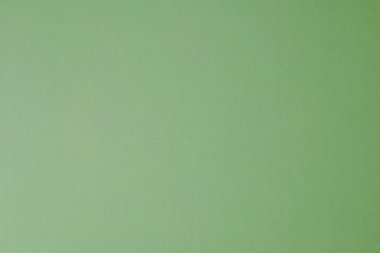 Boş açık yeşil pastel renkli kağıt desenli arka plan. Pastel yeşil kağıt dokusu veya kağıt arkaplan. Tasarım için pürüzsüz kağıt.